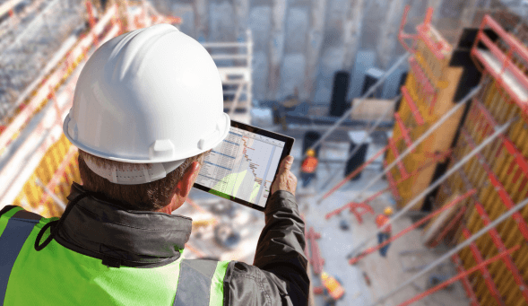 Construction manager looking at data