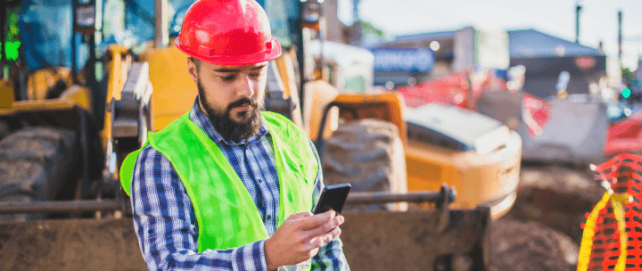Worker reporting a close call on his phone