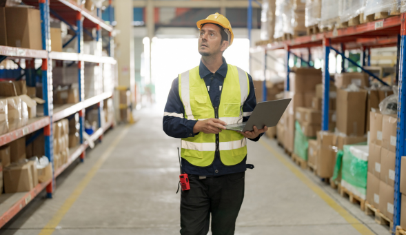 Logistics manager with laptop