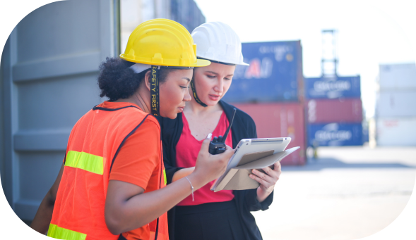 Two workers using health and safety software on site