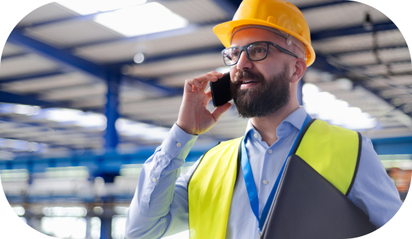 Manager on phone with laptop