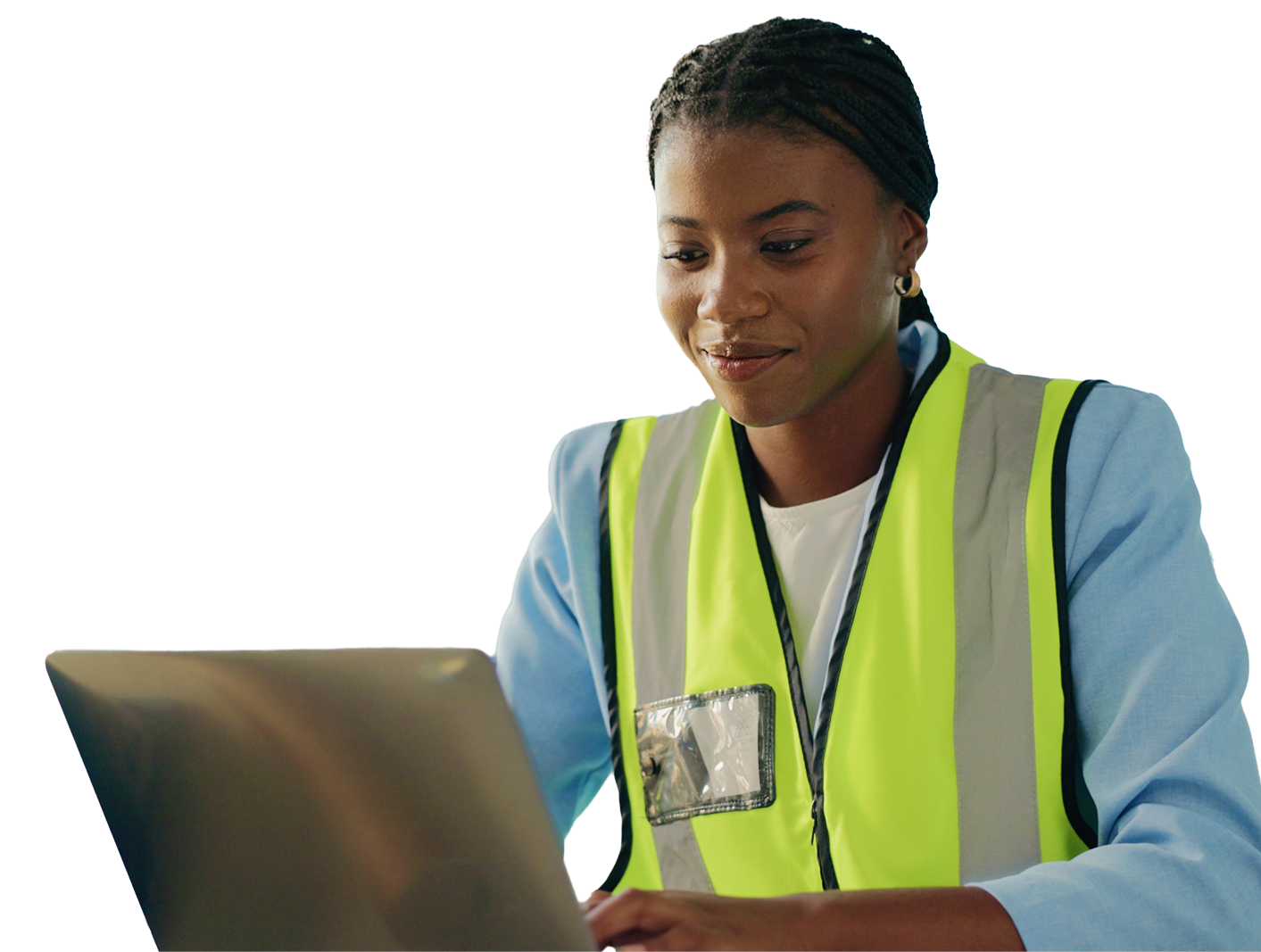 Woman wearing a high-visibility vest working on a laptop